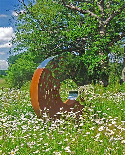 Portal large garden sculpture in two interwoven metals