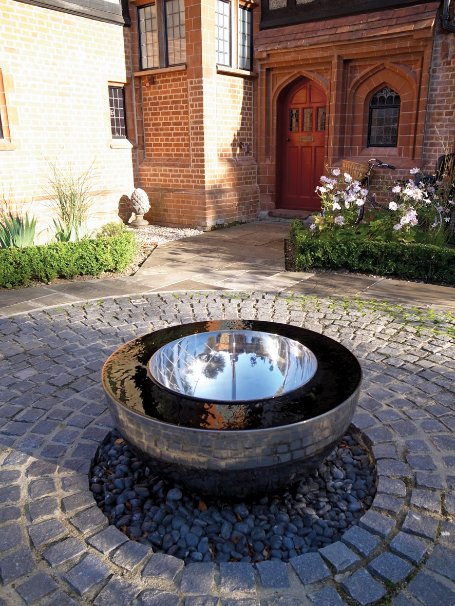 Chalice water feature set on a gravel terrace