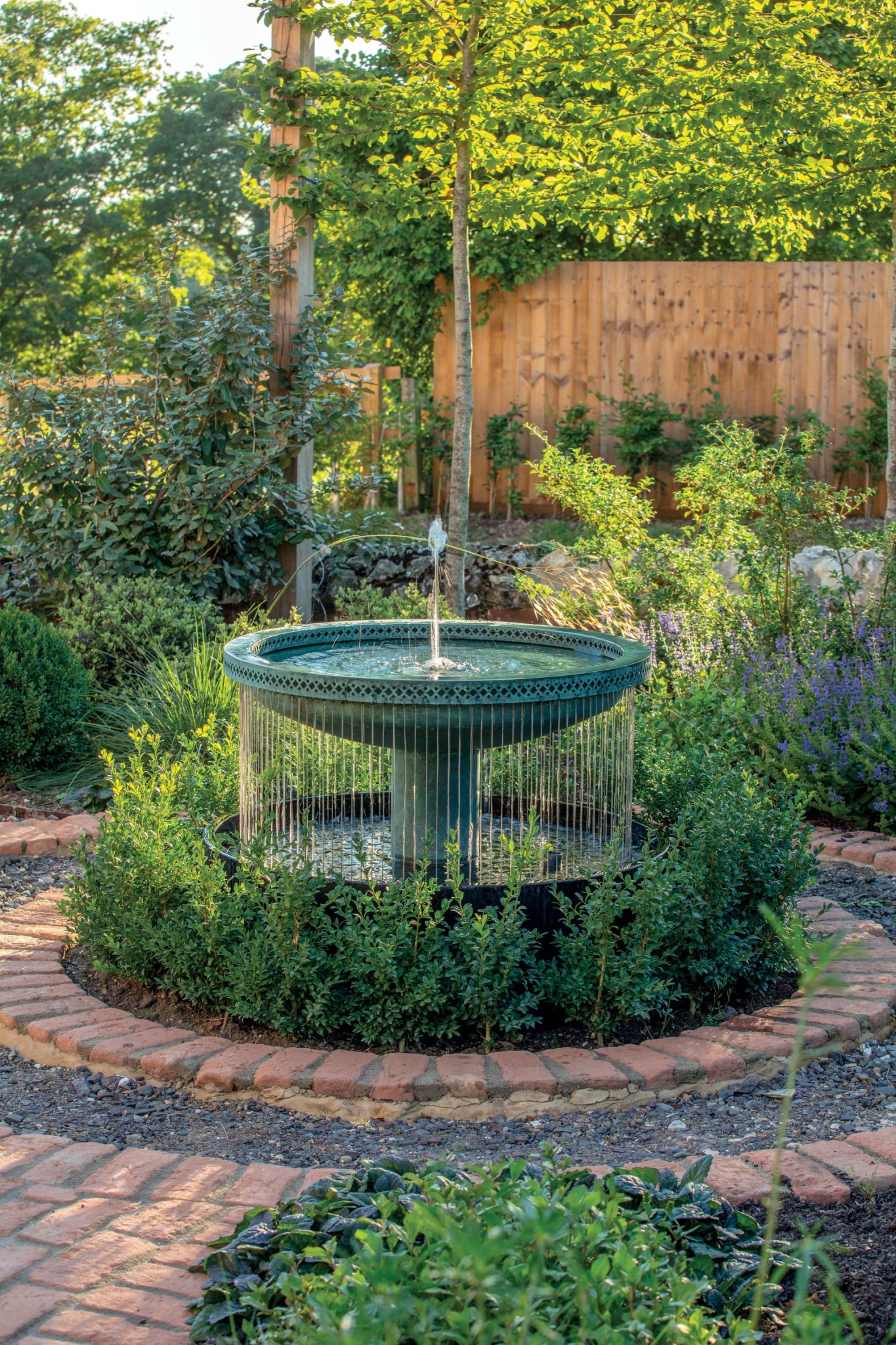 Mimeo Cascade as the focal point of a classically styled garden