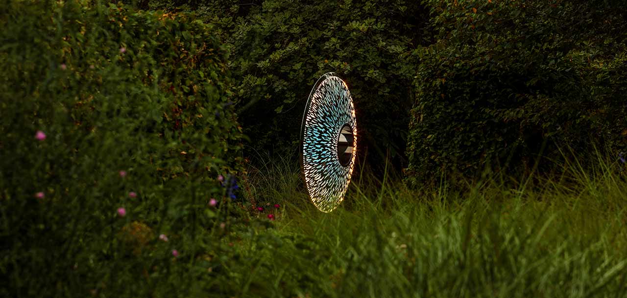 Iris Torus sculpture encircled by flexible LED strip lighting