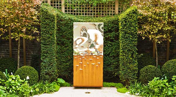 Oxidised metal outdoor garden art, the Titan