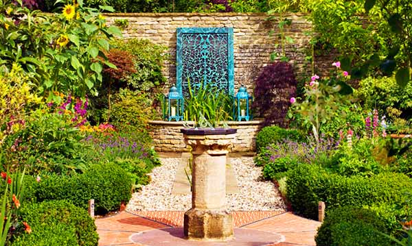 Bronze water wall in a garden