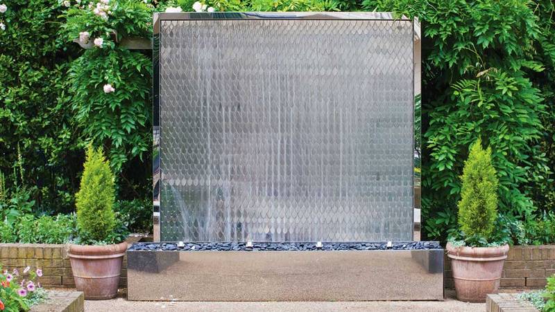 Stainless steel water wall with water streaming down