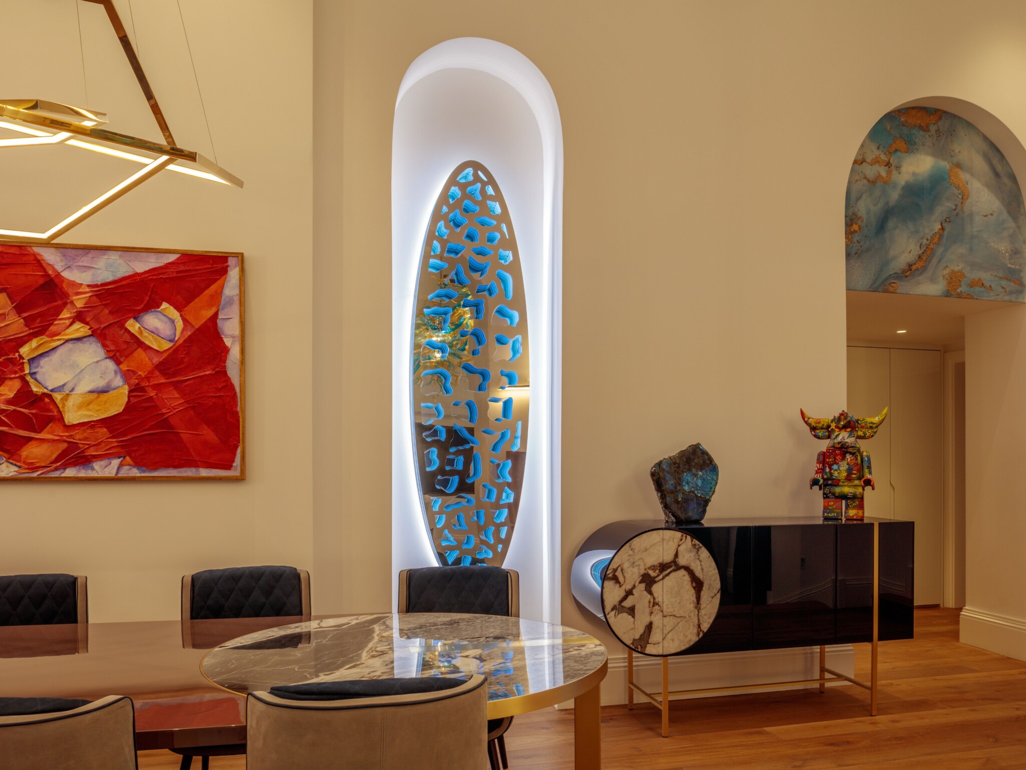 Interior David Harber wall art piece, made of stainless steel, backlit with LED lights.