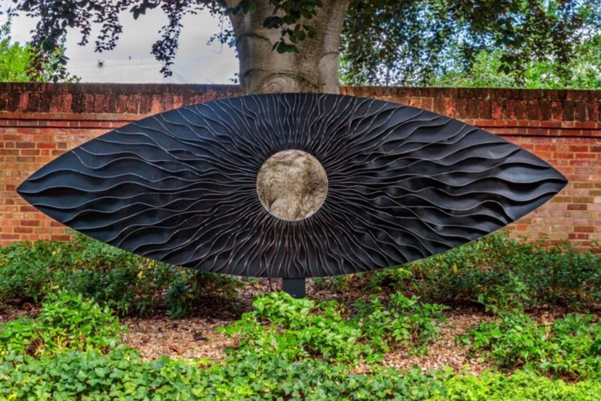 Large bespoke, black powder-coated stainless steel eye sculpture.