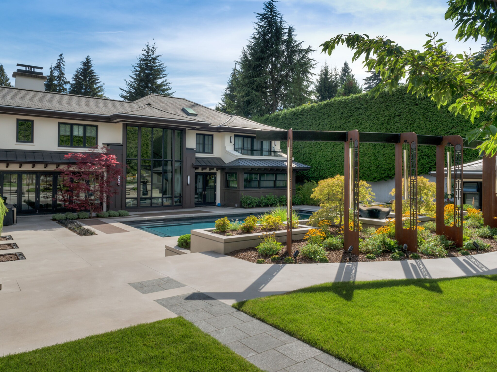 Beautiful, formal gardens in Canada elevated by a bespoke Corten steel sculpture by British luxury sculpture company David Harber