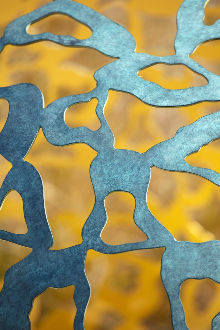 close up of geminus contemporary sculpture in bronze and gold material