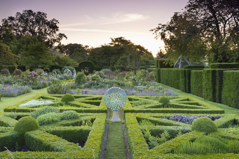 geminus landscape sculpture in bronze and gold in Helmingham Hall