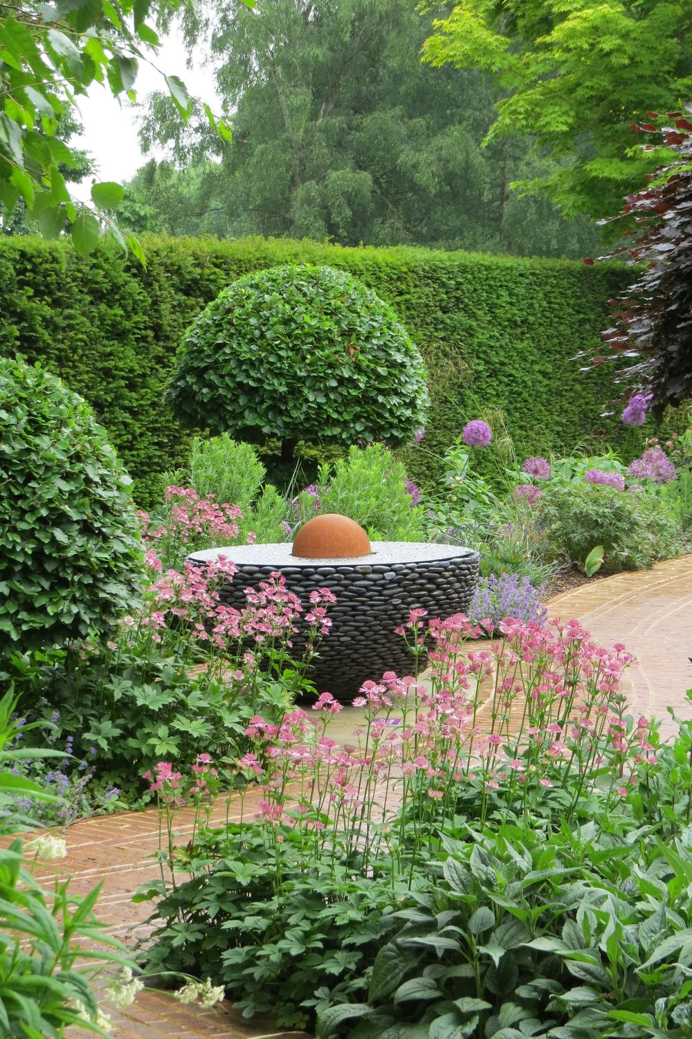 round stone water feature ideal for architectural garden design